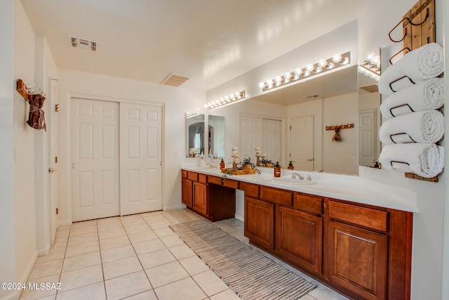 bathroom featuring vanity and tile patterned flooring