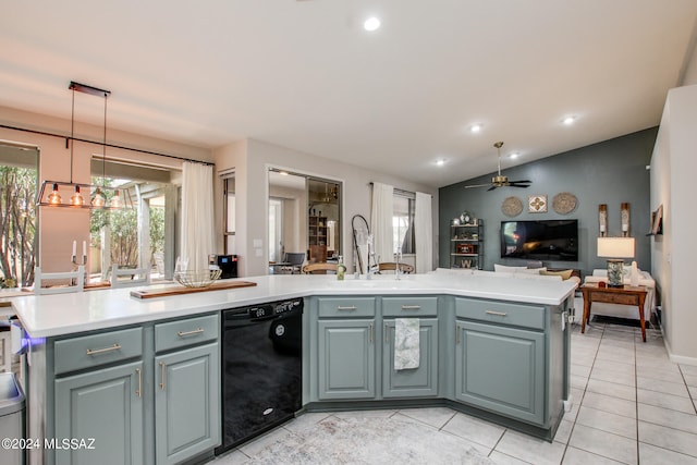 kitchen with black dishwasher, sink, lofted ceiling, decorative light fixtures, and a kitchen island with sink