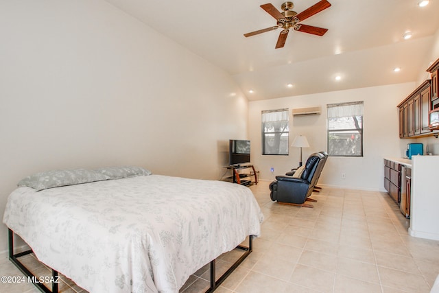 bedroom featuring lofted ceiling, a wall mounted AC, light tile patterned floors, and ceiling fan