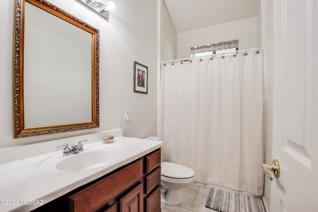 bathroom featuring vanity, a shower with shower curtain, toilet, and tile patterned flooring