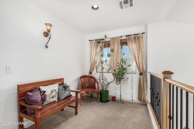 sitting room with an upstairs landing, vaulted ceiling, recessed lighting, carpet, and visible vents
