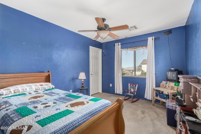 bedroom featuring carpet flooring, ceiling fan, and visible vents