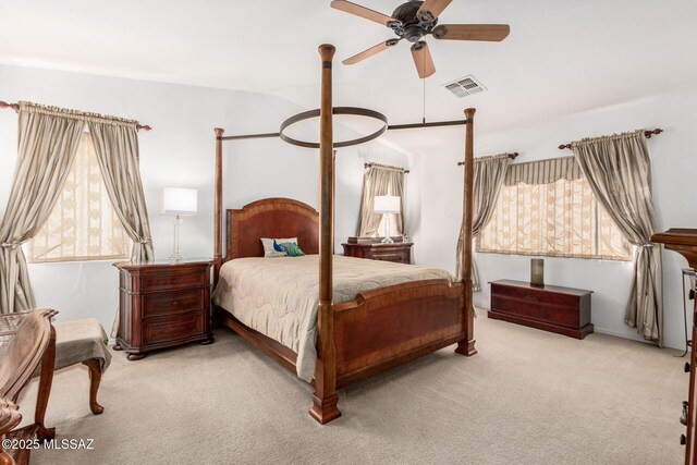 bedroom featuring ceiling fan and light carpet