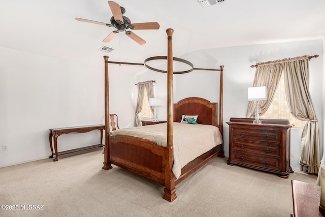 bedroom with ceiling fan, visible vents, and carpet