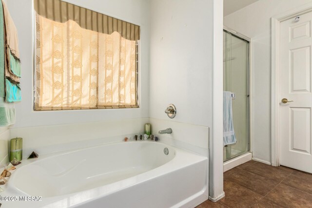 bedroom with ceiling fan and light carpet