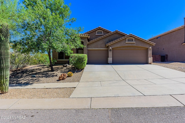 view of front of property with a garage