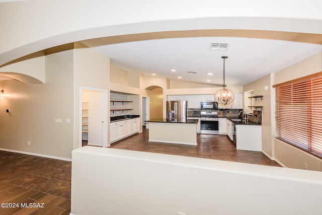 kitchen featuring pendant lighting, white cabinets, stainless steel appliances, and sink