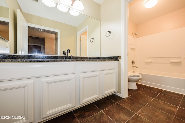 full bathroom featuring tile patterned floors, vanity, washtub / shower combination, and toilet