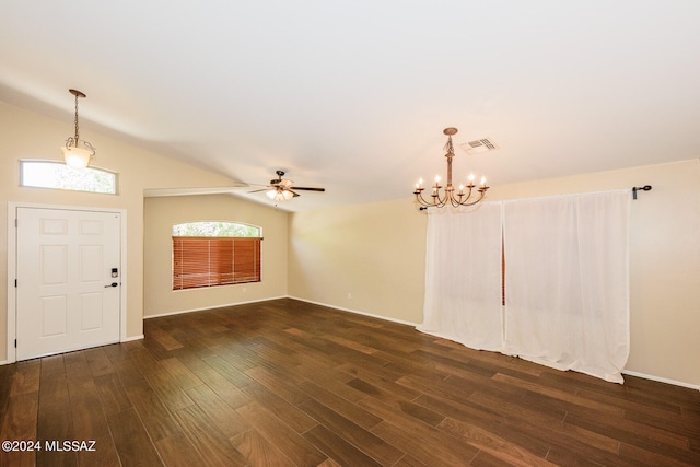 foyer entrance featuring ceiling fan with notable chandelier, dark hardwood / wood-style flooring, and lofted ceiling