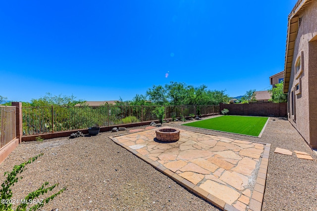 view of patio featuring a fire pit