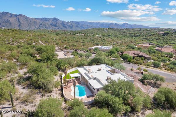 birds eye view of property with a mountain view