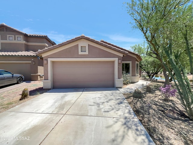 view of front of property with a garage