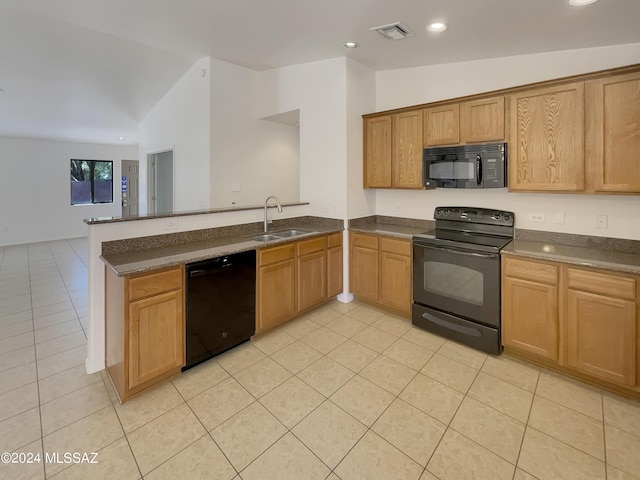 kitchen featuring sink, light tile patterned floors, kitchen peninsula, black appliances, and lofted ceiling