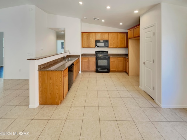 kitchen featuring sink, black appliances, lofted ceiling, light tile patterned floors, and kitchen peninsula