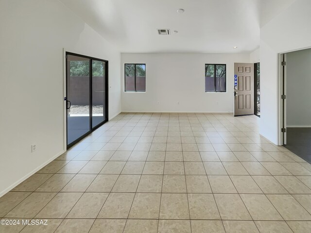 spare room with light tile patterned flooring