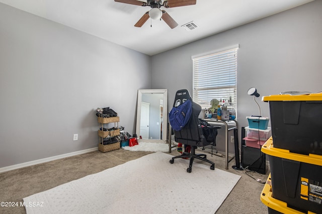 office area featuring ceiling fan and light carpet