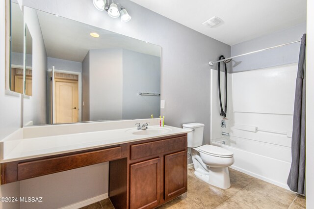 full bathroom featuring tile patterned flooring, toilet, vanity, and shower / bath combo