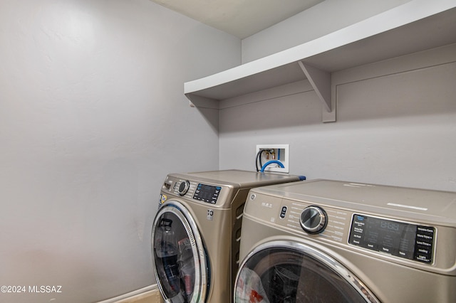 laundry area with washing machine and dryer