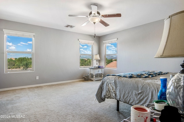 bedroom featuring ceiling fan and carpet floors