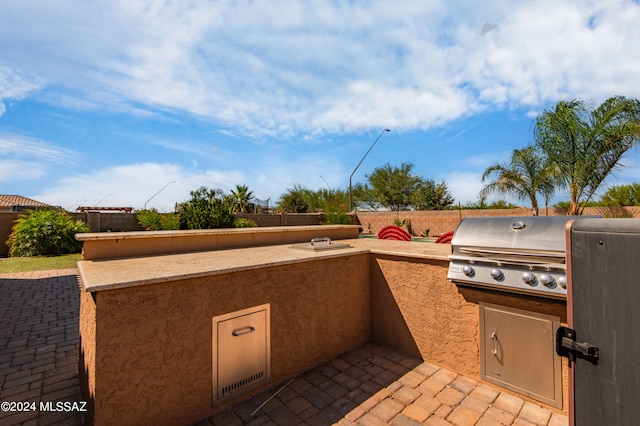 view of patio / terrace with a grill and area for grilling