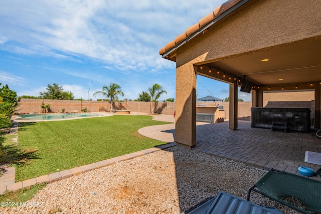 view of yard with a fenced in pool and a patio