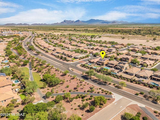 birds eye view of property featuring a mountain view