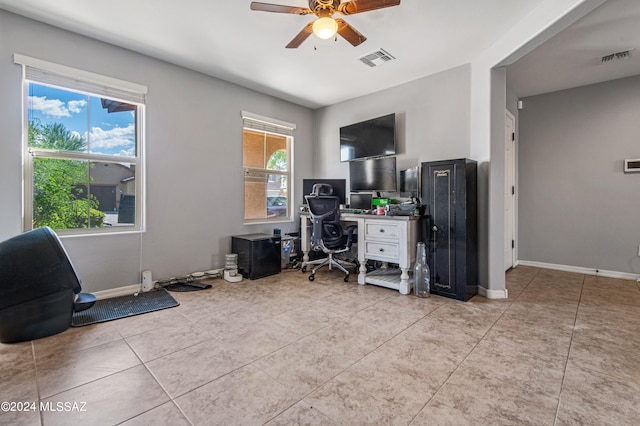 tiled office space with ceiling fan