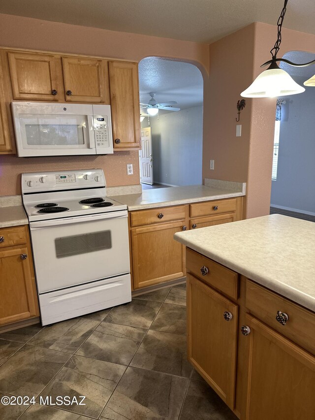 kitchen with ceiling fan, decorative light fixtures, and white appliances