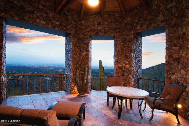 view of patio terrace at dusk