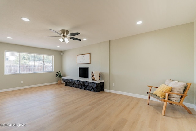 interior space with ceiling fan and light hardwood / wood-style floors