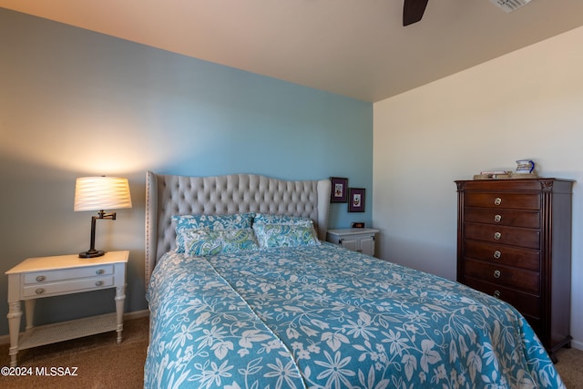 bedroom with ceiling fan and carpet floors