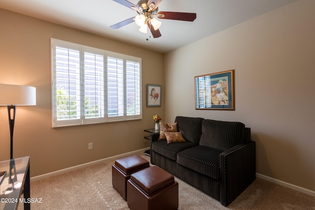 living room featuring ceiling fan and light colored carpet