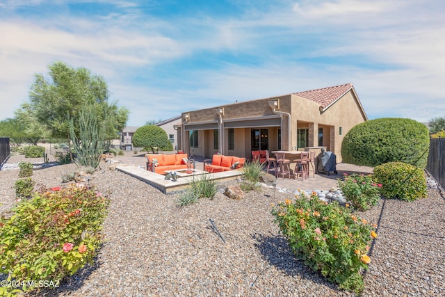 rear view of house with a patio area and an outdoor hangout area