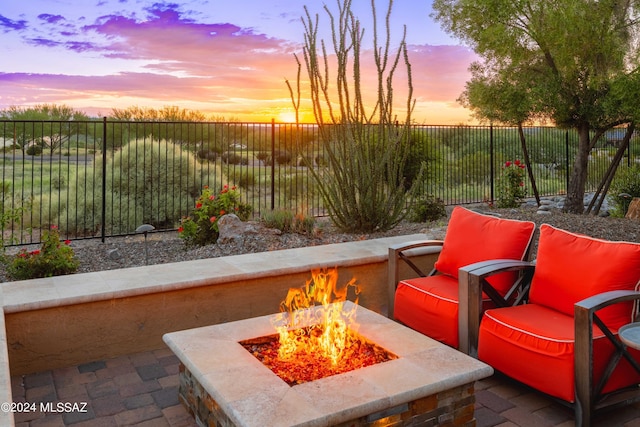 patio terrace at dusk with an outdoor fire pit