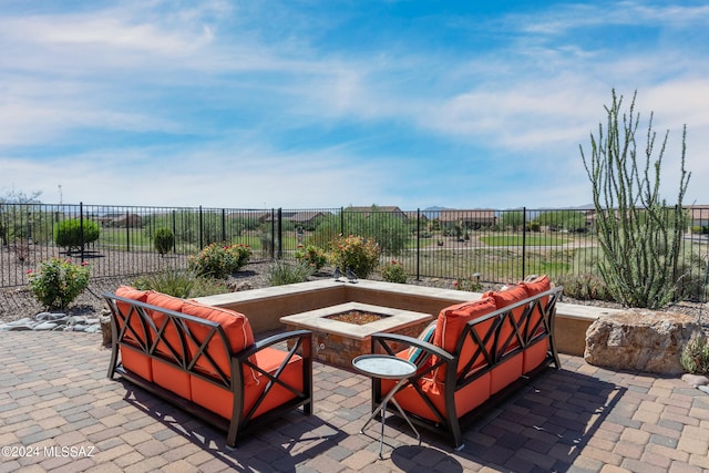 view of patio with an outdoor fire pit