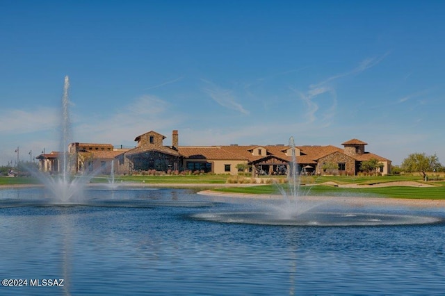 view of pool featuring a water view