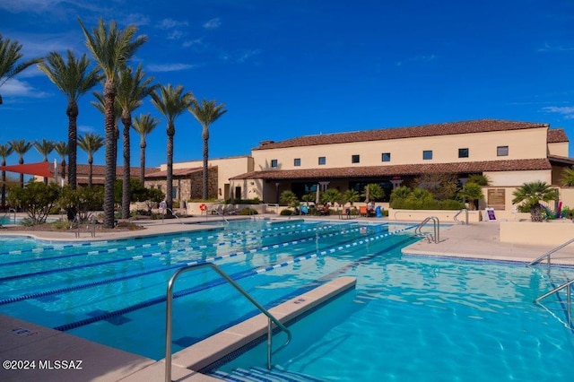 view of swimming pool with a patio area