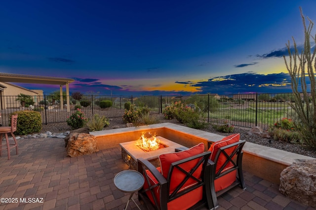 patio terrace at dusk with a fire pit