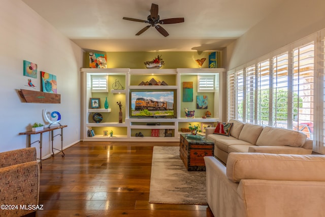 living room featuring dark hardwood / wood-style floors and ceiling fan