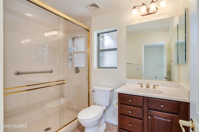 bathroom featuring tile patterned flooring, toilet, visible vents, vanity, and a stall shower