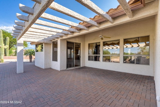 view of patio / terrace with a ceiling fan and a pergola