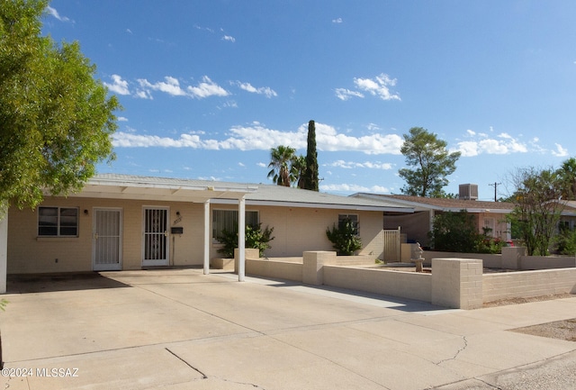 view of front of property with a patio and central air condition unit