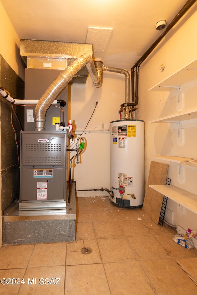 utility room featuring water heater