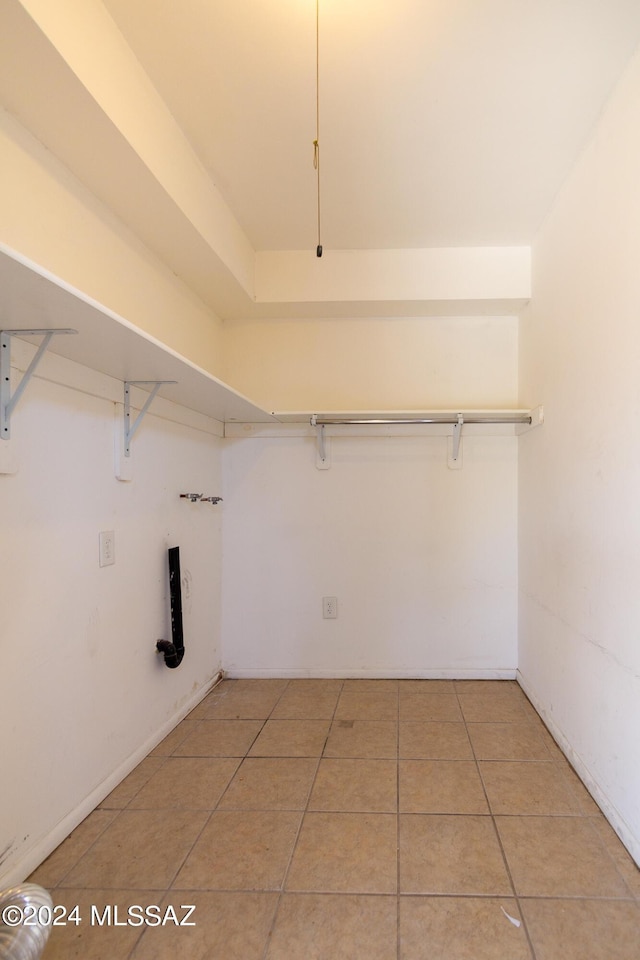 laundry room with hookup for a washing machine and tile patterned floors