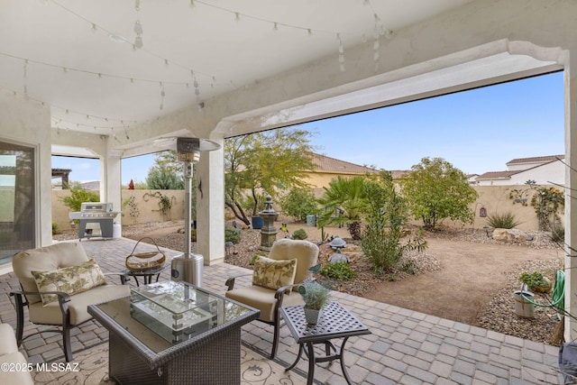 view of patio featuring an outdoor living space and grilling area