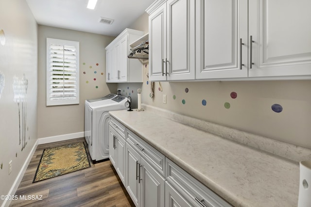 laundry area featuring dark hardwood / wood-style floors, cabinets, and hookup for a washing machine