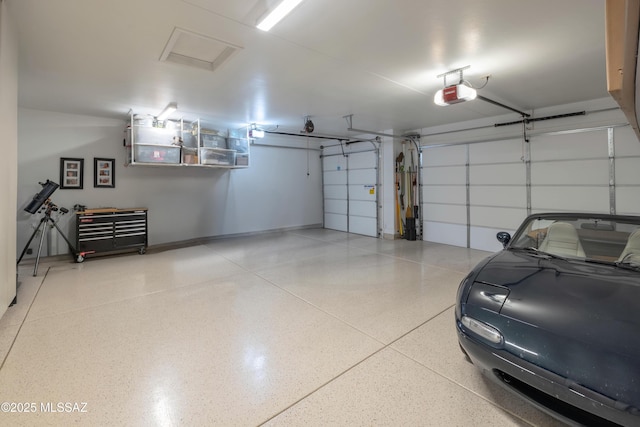 garage featuring a garage door opener