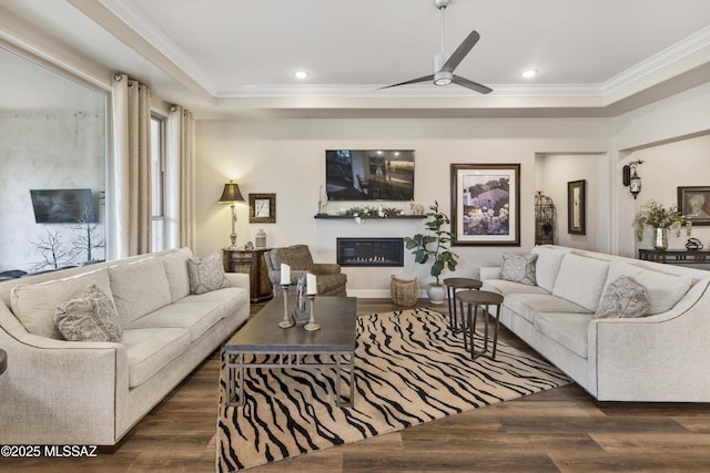 living room featuring ceiling fan, dark hardwood / wood-style floors, and ornamental molding