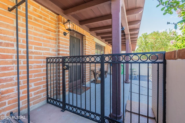 view of gate featuring fence