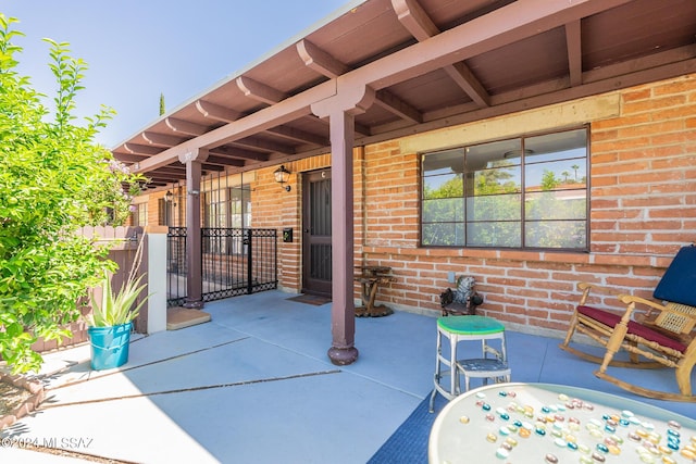 view of patio featuring fence